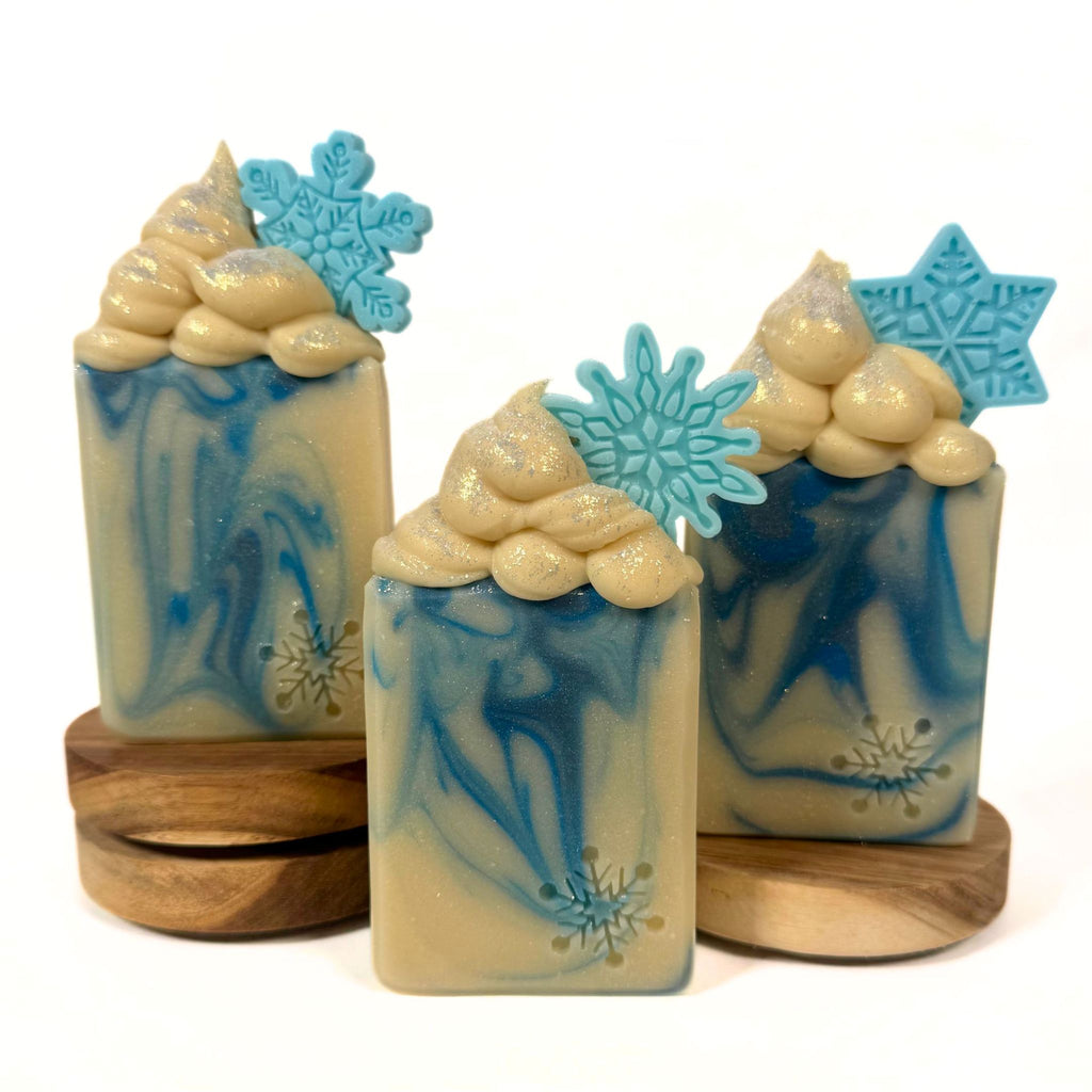 Let It Snow handmade Christmas soap with blue and cream swirls and snowflake detail by Artesana Soaps