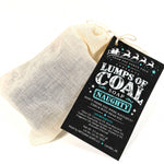 Load image into Gallery viewer, Lumps of Coal handmade charcoal soap in a muslin gift bag, a fun Christmas stocking stuffer.
