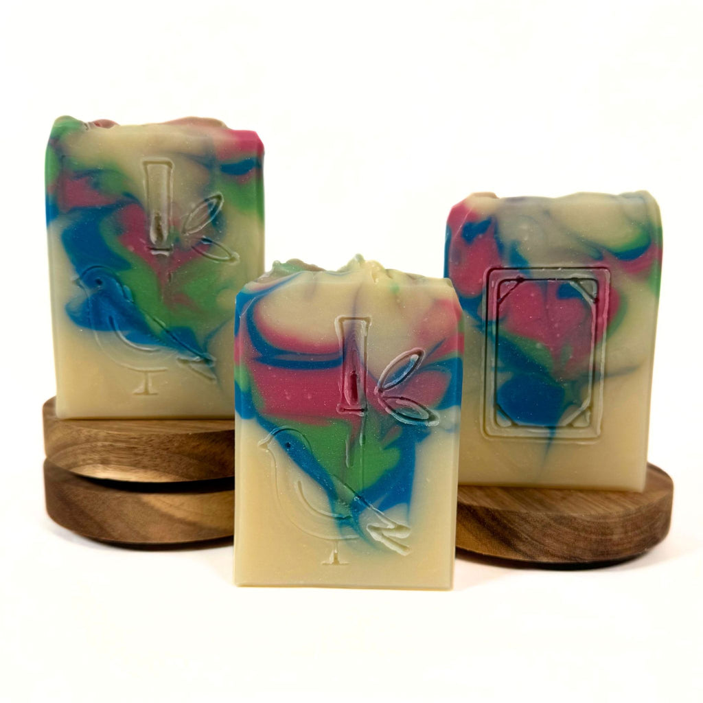 Handmade Mahjong tile soaps by Artesana Soaps featuring Bird Bam and White Dragon designs with colorful swirls, scented in Berry Bloom.
