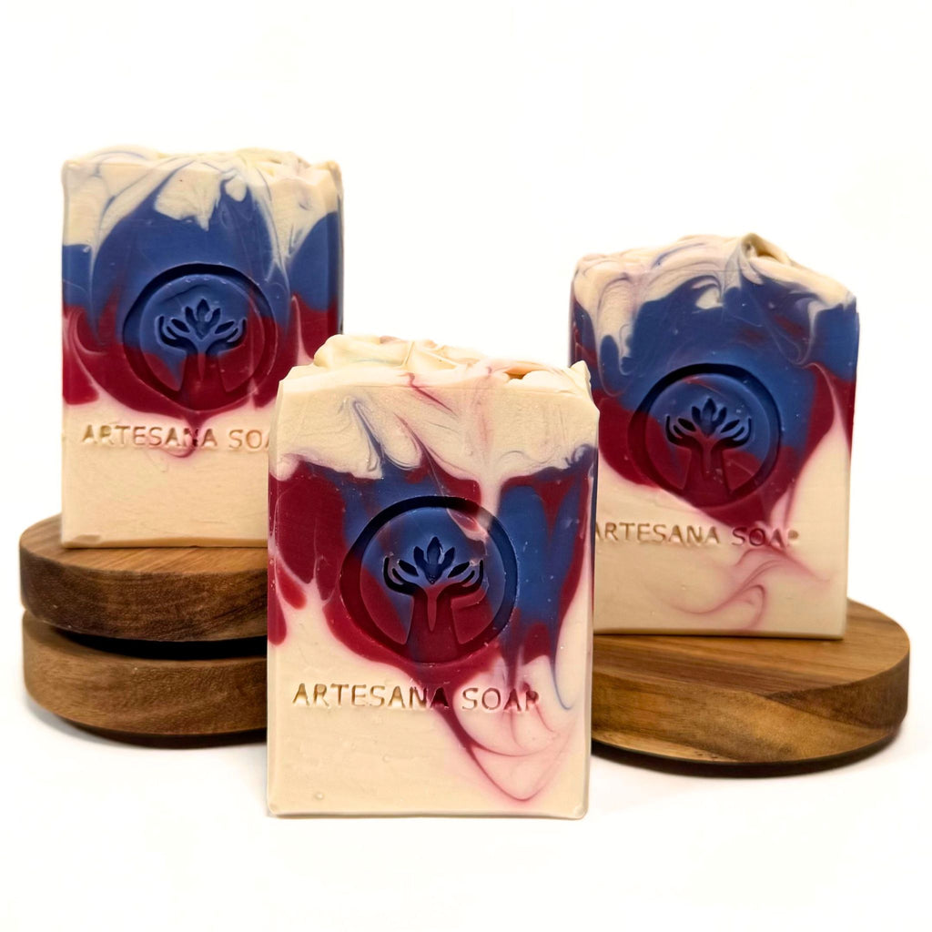 Merica handmade patriotic soap bar in red, white and blue by Artesana Soaps, with a tropical pineapple and coconut fragrance.