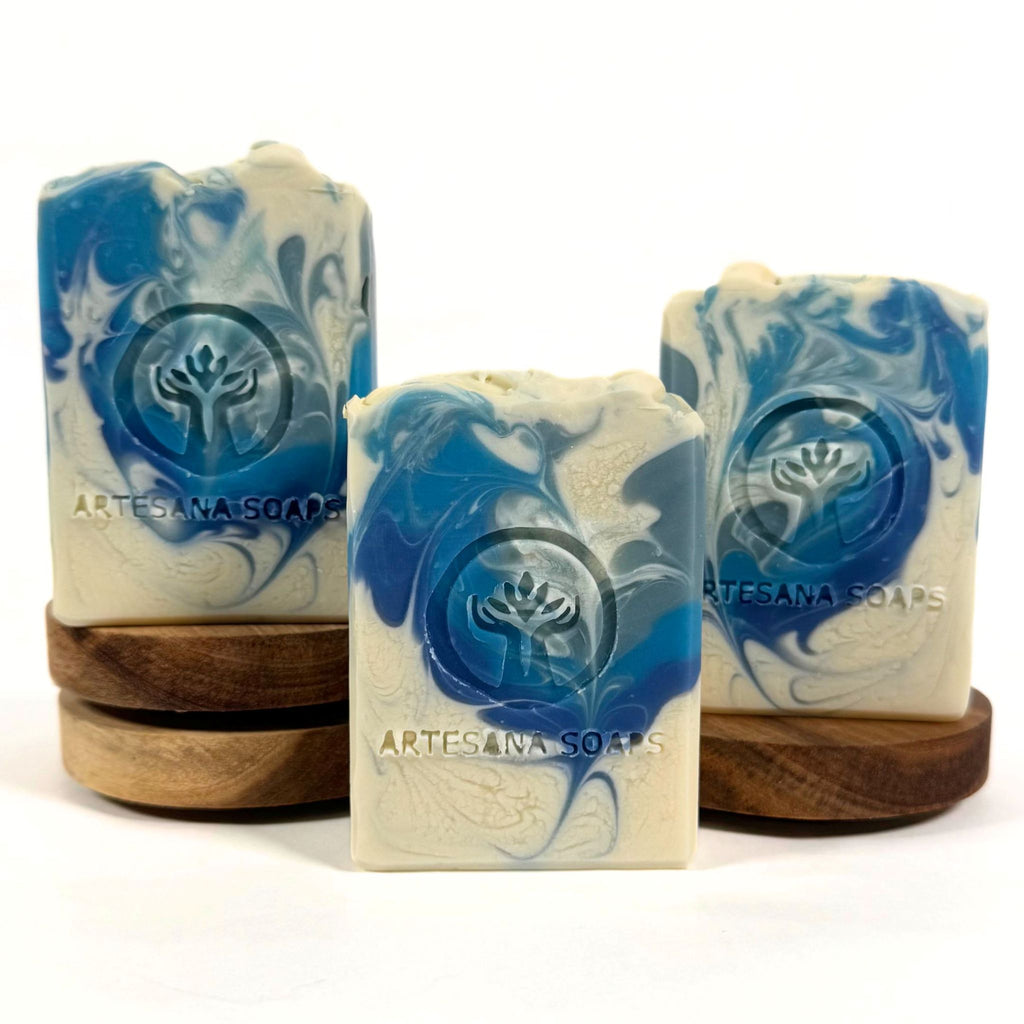 Volcano handmade soap bar with blue and white swirls and a tropical citrus fragrance by Artesana Soaps.